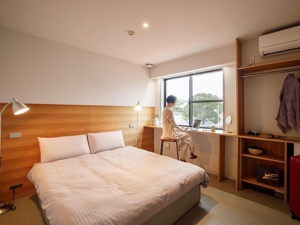 Denpaku Amami Hotel Bagian luar foto